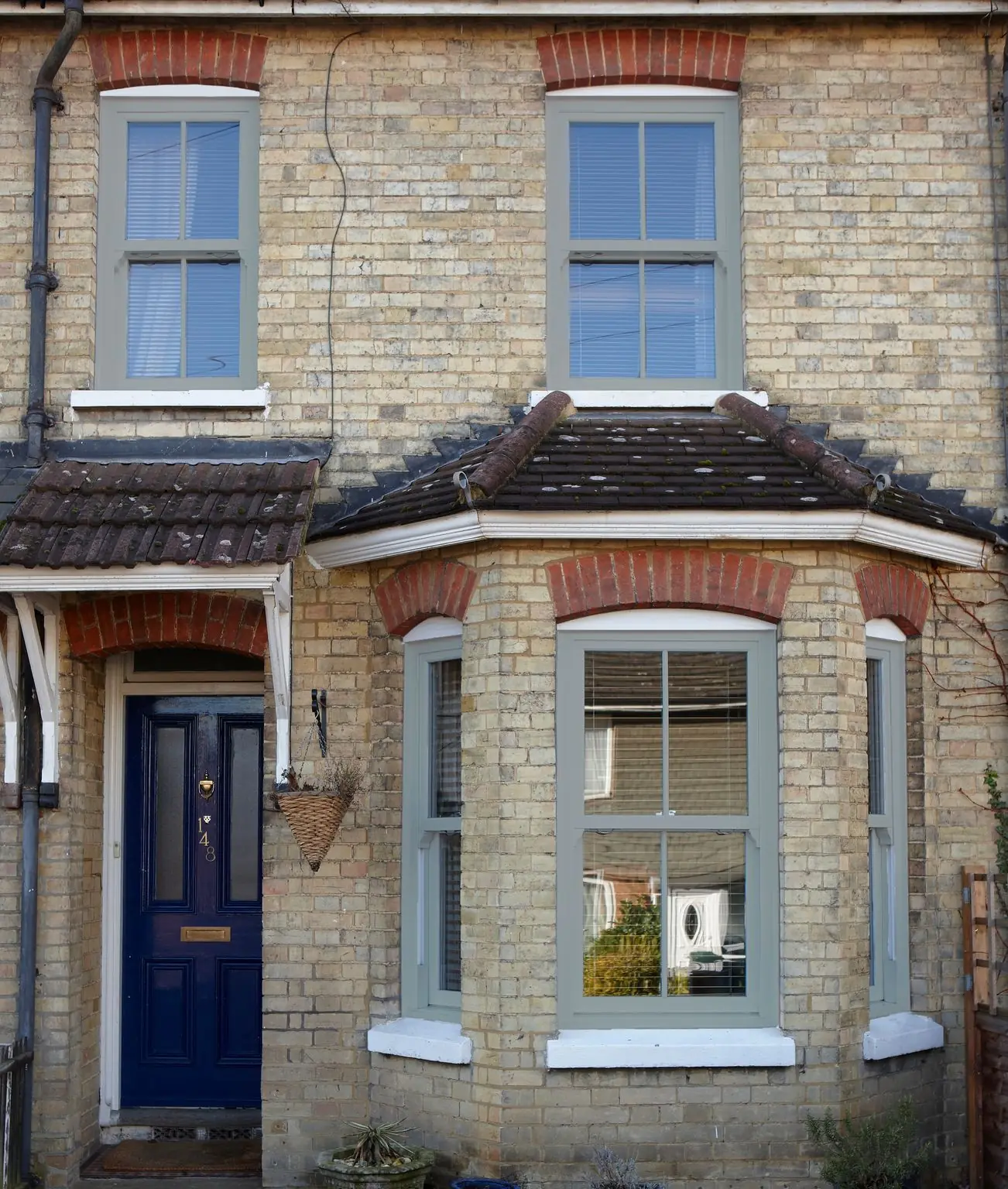 Sliding sash windows on a Victorian bay