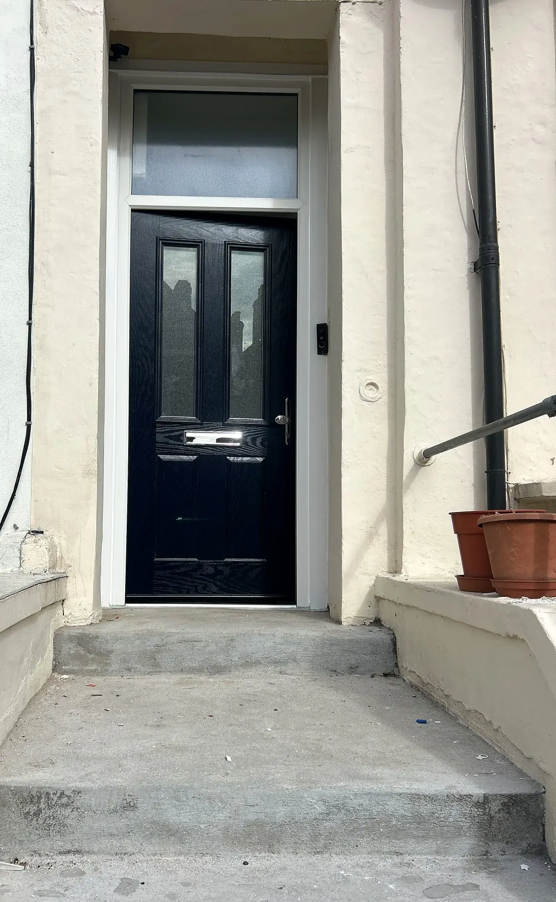 Black composite door with toplight