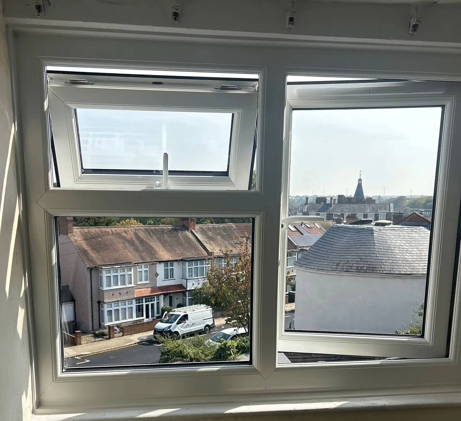 uPVC casements open over the rooftops